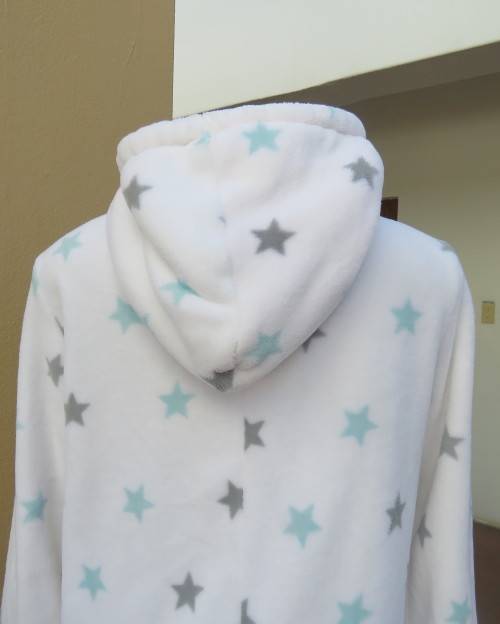 Warm and cost ladies hooded onesie pajamas in white with star pattern.Size 34 to 36.New condition.