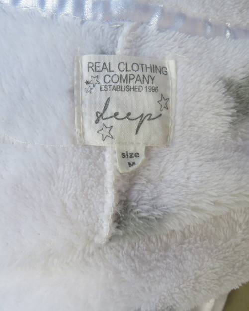 Warm and cost ladies hooded onesie pajamas in white with star pattern.Size 34 to 36.New condition.