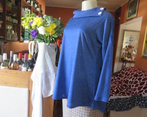 Striking azure blue long sleeve slip over poycotton stretch top.Fold over collar.Size 36/12.As new.