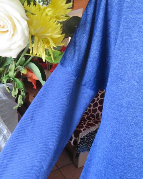 Striking azure blue long sleeve slip over poycotton stretch top.Fold over collar.Size 36/12.As new.