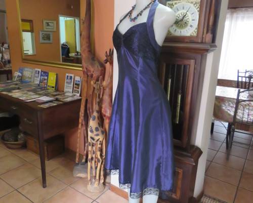 Sexy boutique made eggplant purple satin halter neck dress with black lace decor. Size 34/10.