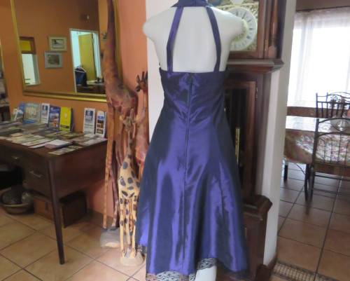 Sexy boutique made eggplant purple satin halter neck dress with black lace decor. Size 34/10.