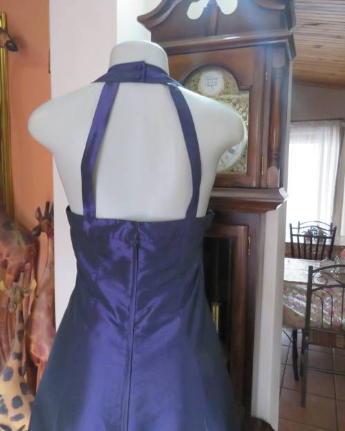 Sexy boutique made eggplant purple satin halter neck dress with black lace decor. Size 34/10.