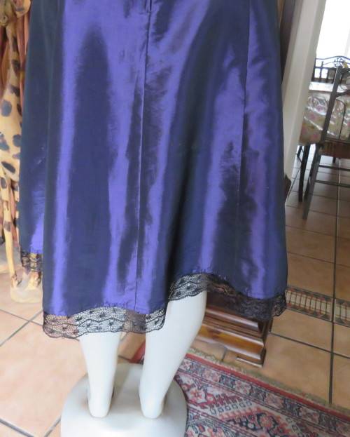 Sexy boutique made eggplant purple satin halter neck dress with black lace decor. Size 34/10.