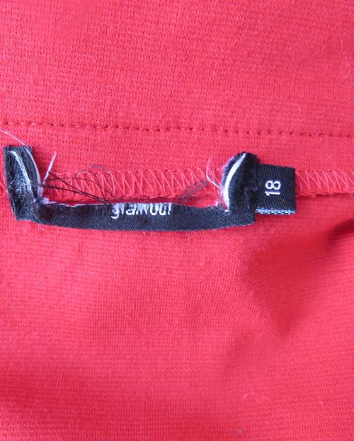 Smart red pencil skirt in red jersey fabric with some stretch.Size 42/18. Pleat at back. As new.