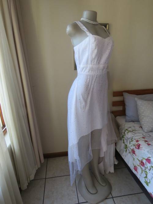 Pretty white strappy evening dress with glitter/embellishment.High/low seamline.Size 36 by GERANO