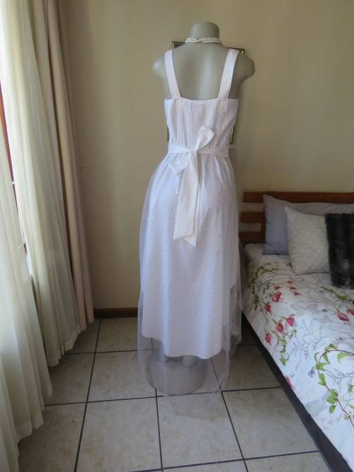 Pretty white strappy evening dress with glitter/embellishment.High/low seamline.Size 36 by GERANO