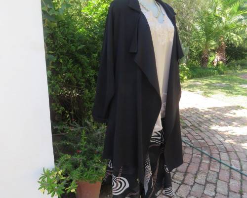 Stunning long black waterfall style loose hanging jacket.Spotless.As new.Bracelet sleeves.Size 42/18
