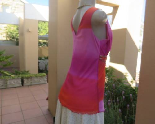 Super sexy cross over top in sheer pink/crimson fabric.Braiding with gold in waist.Size 36.By OASIS.