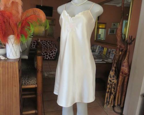 Vanilla colour silky satin polyester nighty with adjustable straps.By BODYLINE size 36 to 38.As new.
