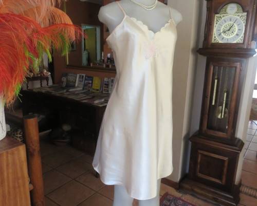 Vanilla colour silky satin polyester nighty with adjustable straps.By BODYLINE size 36 to 38.As new.