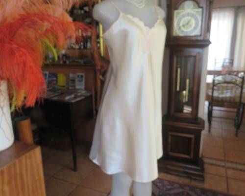 Vanilla colour silky satin polyester nighty with adjustable straps.By BODYLINE size 36 to 38.As new.