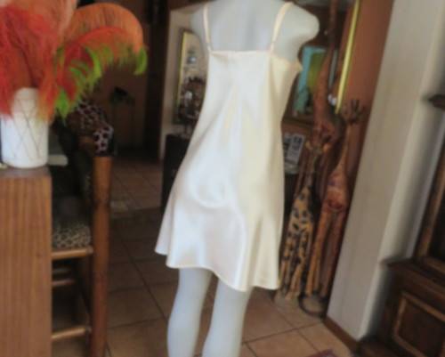 Vanilla colour silky satin polyester nighty with adjustable straps.By BODYLINE size 36 to 38.As new.