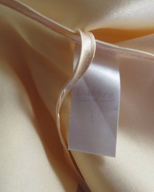 Vanilla colour silky satin polyester nighty with adjustable straps.By BODYLINE size 36 to 38.As new.