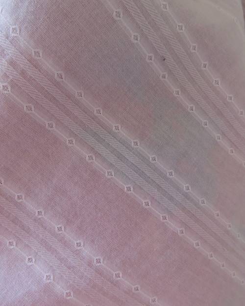 Sleeveless white 100%cotton embossed empire top.Crossover bust.Floral print decoration.42