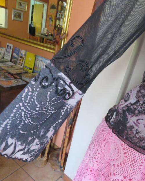 Stunning sheer black long sleeve top. Pale pink flowers on top layer.Size 34 by GOLD.Cord decoration