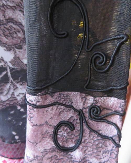 Stunning sheer black long sleeve top. Pale pink flowers on top layer.Size 34 by GOLD.Cord decoration