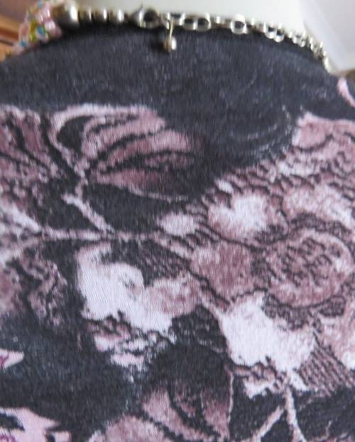 Stunning sheer black long sleeve top. Pale pink flowers on top layer.Size 34 by GOLD.Cord decoration