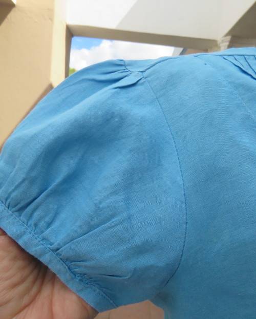 KELSO linen top with button down V front with collar in sky blue size 36/12.Tucked bib on front.