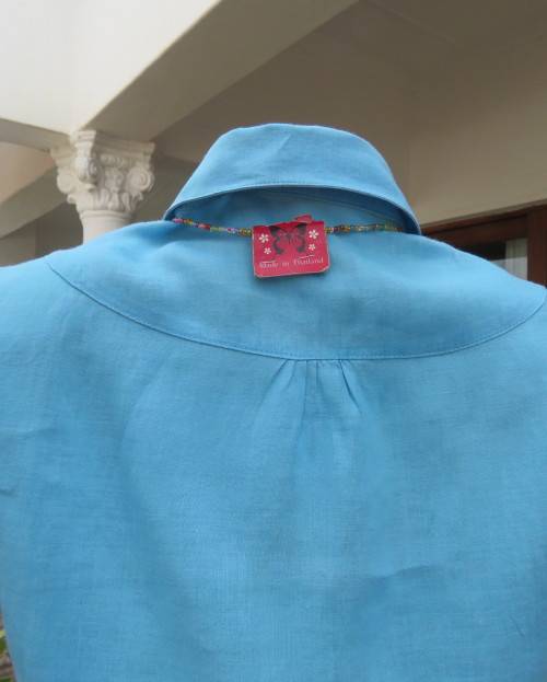 KELSO linen top with button down V front with collar in sky blue size 36/12.Tucked bib on front.