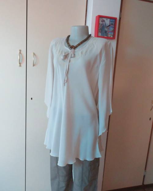 Beautiful wheat polyester slip over top Long angel sleeves.Scooped neckline with tiestring.Size 44