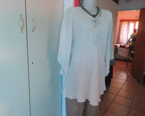 Beautiful wheat polyester slip over top Long angel sleeves.Scooped neckline with tiestring.Size 44