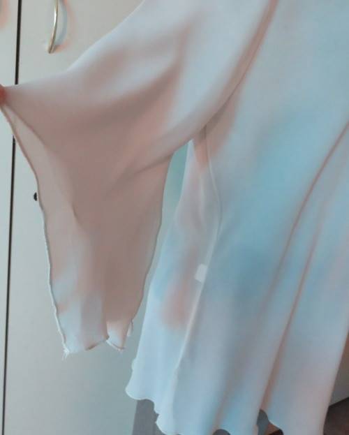 Beautiful wheat polyester slip over top Long angel sleeves.Scooped neckline with tiestring.Size 44