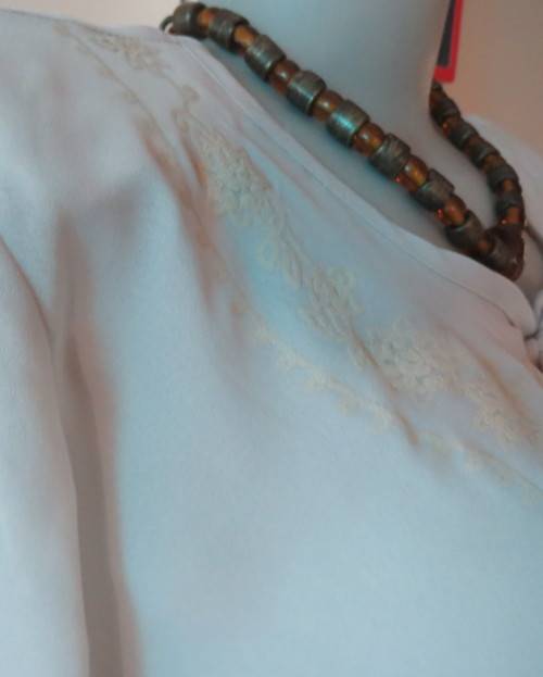 Beautiful wheat polyester slip over top Long angel sleeves.Scooped neckline with tiestring.Size 44