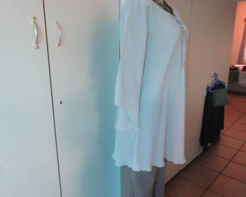 Beautiful wheat polyester slip over top Long angel sleeves.Scooped neckline with tiestring.Size 44