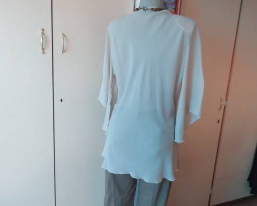 Beautiful wheat polyester slip over top Long angel sleeves.Scooped neckline with tiestring.Size 44