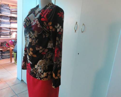 Black stretch polyester background with red,purple and gold floral pattern top.Tiny bolero.Size 38