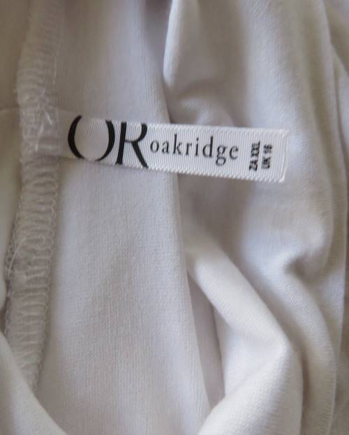 Handy white poloneck long sleeve top in stretch viscose by OR size 40/16.Perfect for under jacket.