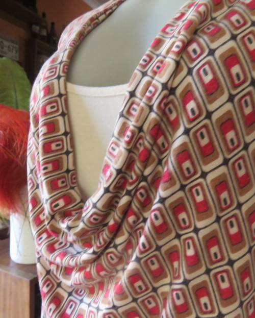 Smart soft long sleeve top in cream/brown/red block pattern.Cream underlay.Size 42/18.Cowl collar.