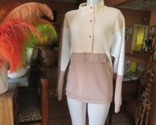Cosy, warm cream/tan/white colour block long sleeve brushed polyester top.Size 38/14.Dolman sleeves.