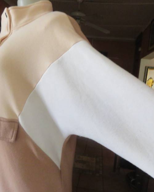 Cosy, warm cream/tan/white colour block long sleeve brushed polyester top.Size 38/14.Dolman sleeves.
