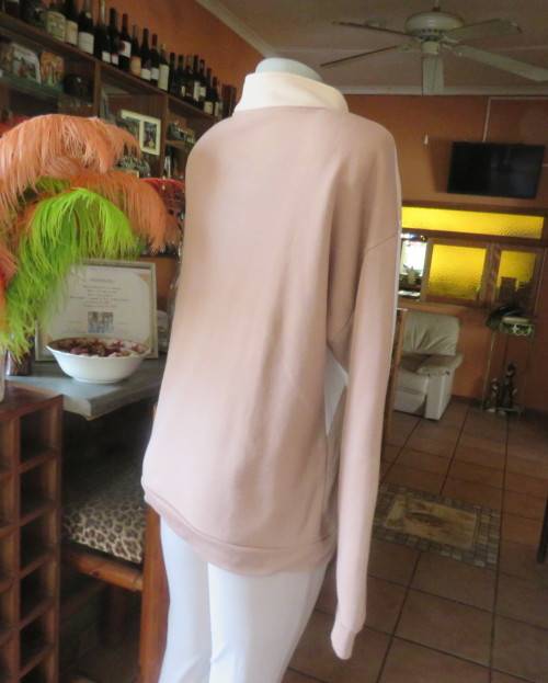 Cosy, warm cream/tan/white colour block long sleeve brushed polyester top.Size 38/14.Dolman sleeves.