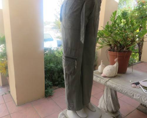 Vintage authentic 100% cotton. Wash out distressed look.Sage green.Pockets and stitching galore. 34.