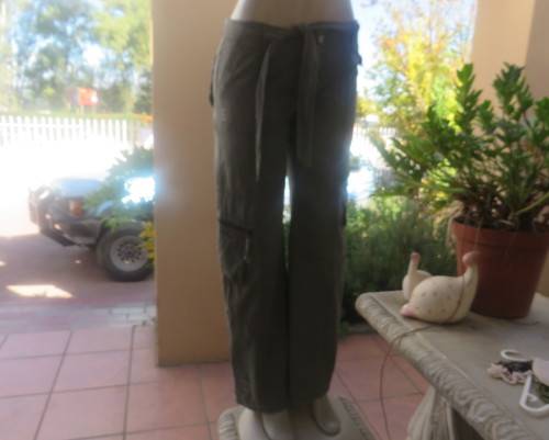 Vintage authentic 100% cotton. Wash out distressed look.Sage green.Pockets and stitching galore. 34.