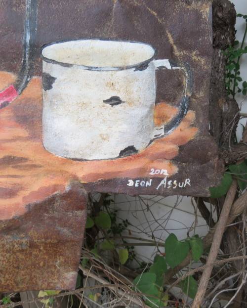 Unique junk art by DEON ASSUR 2012 on rusted metal. Red coffee pot with white mug.Size 36cm x 36cm