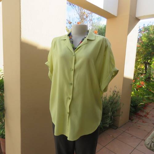 Chartreuse green button down/open collar and short cut-on sleeves. By WOOLWORTHS size 36/12.
