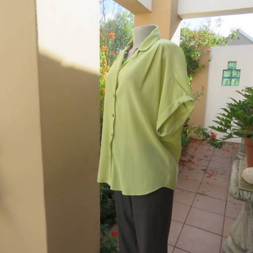 Chartreuse green button down/open collar and short cut-on sleeves. By WOOLWORTHS size 36/12.