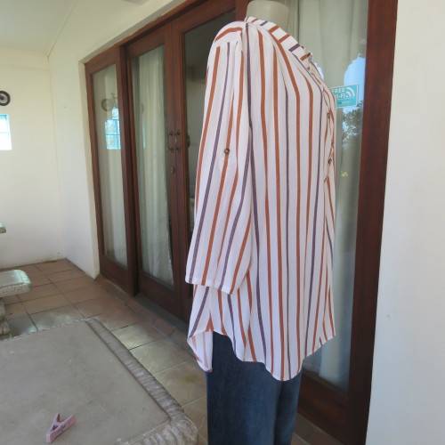 Cheeky poly/viscose long sleeve top. Blue/brick vertical stripes. High banded neck/opening.Size 46.
