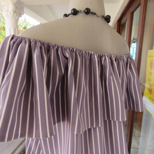 Lovely silver grey/white vertical striped top with wide elasticated frilled neckline.Size 38.As new