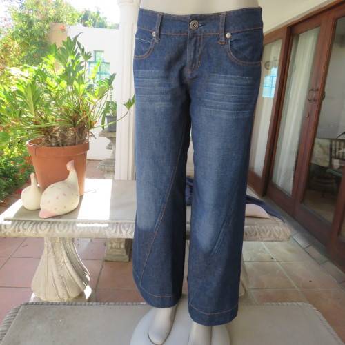 Low rise fashion blue denim jeans. Wide legged. 100% cotton.By RT size 36/12. New condition