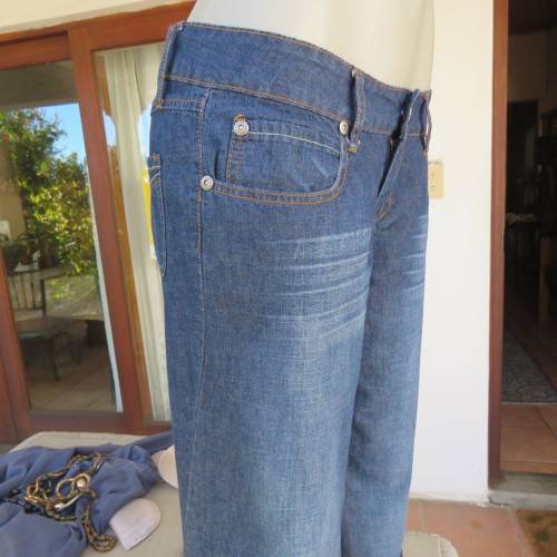 Low rise fashion blue denim jeans. Wide legged. 100% cotton.By RT size 36/12. New condition