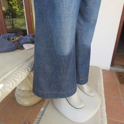 Low rise fashion blue denim jeans. Wide legged. 100% cotton.By RT size 36/12. New condition