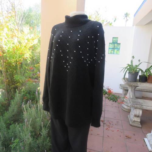Fabulous black polyester/acrylic knitted poloneck pullover cardigan/pearl decorated.Size 44 by M H.