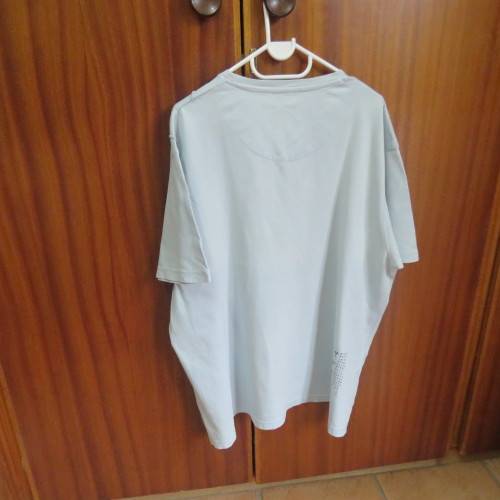 Men`s light blue V neck T Shirt with stitched blocks and black/white logo.Size XXL by F&F in cotton.