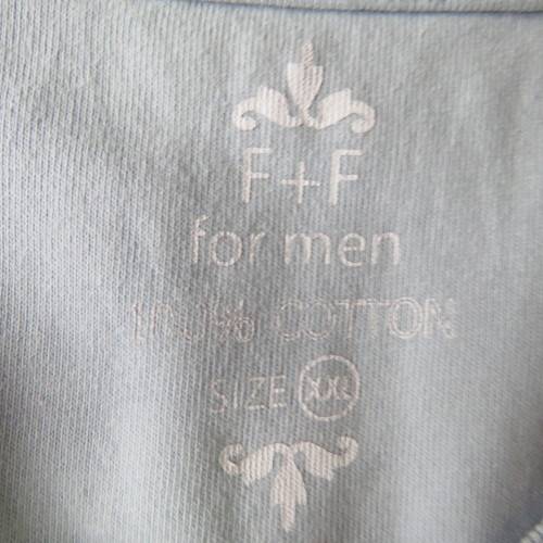 Men`s light blue V neck T Shirt with stitched blocks and black/white logo.Size XXL by F&F in cotton.