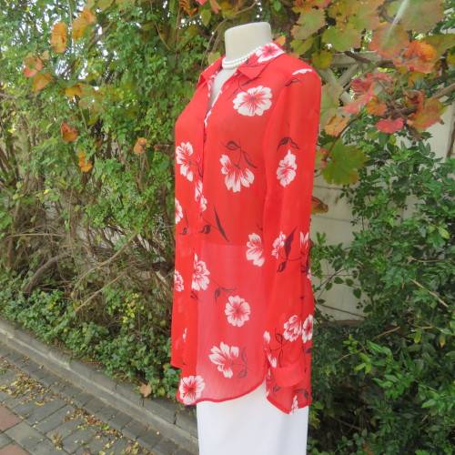 Eye catching red with white floral long top in sheer polyester. Cuffed sleeves. Size 36 by MILADY`S.